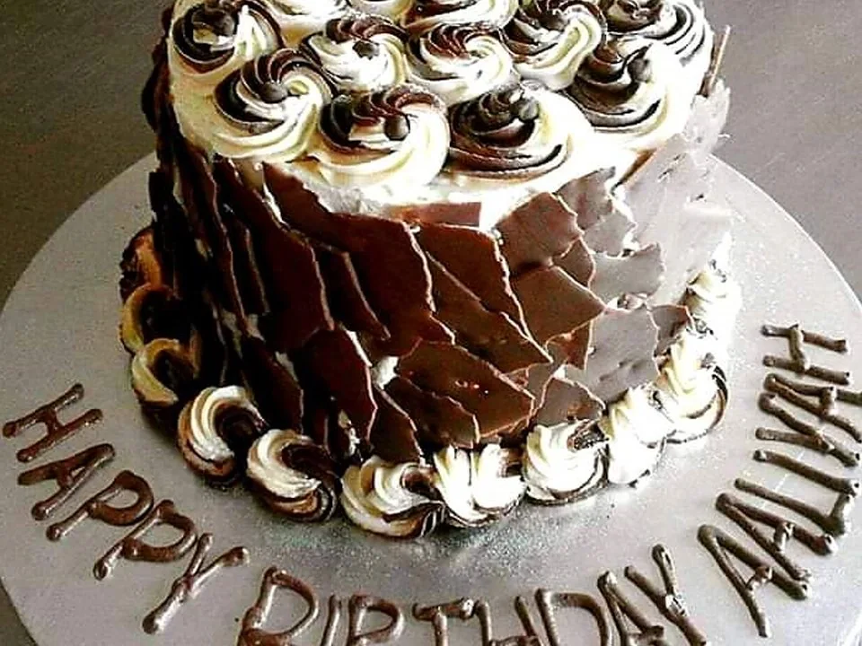 A decorated chocolate birthday cake from Mr Bake